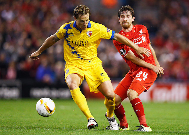 LIVERPOOL, ENGLAND - OCTOBER 01: Joe Allen of Liverpool and Reto Ziegler of Sion compete for the ball during the UEFA Europa League group B match between Liverpool FC and FC Sion at Anfield on October 1, 2015 in Liverpool, United Kingdom. (Photo by Dean Mouhtaropoulos/Getty Images)